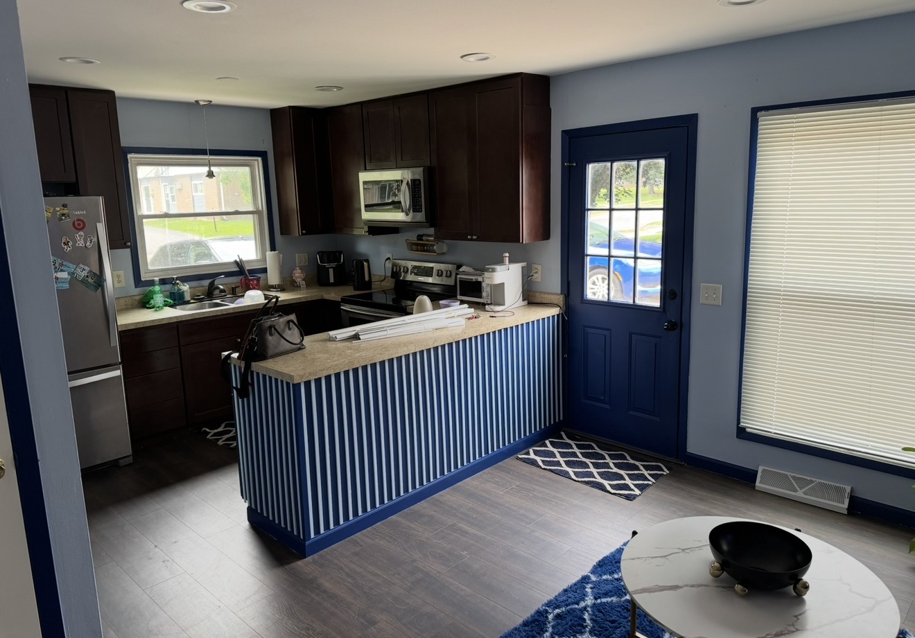Kitchen before the cabinet painting, countertops, and backsplash were completed