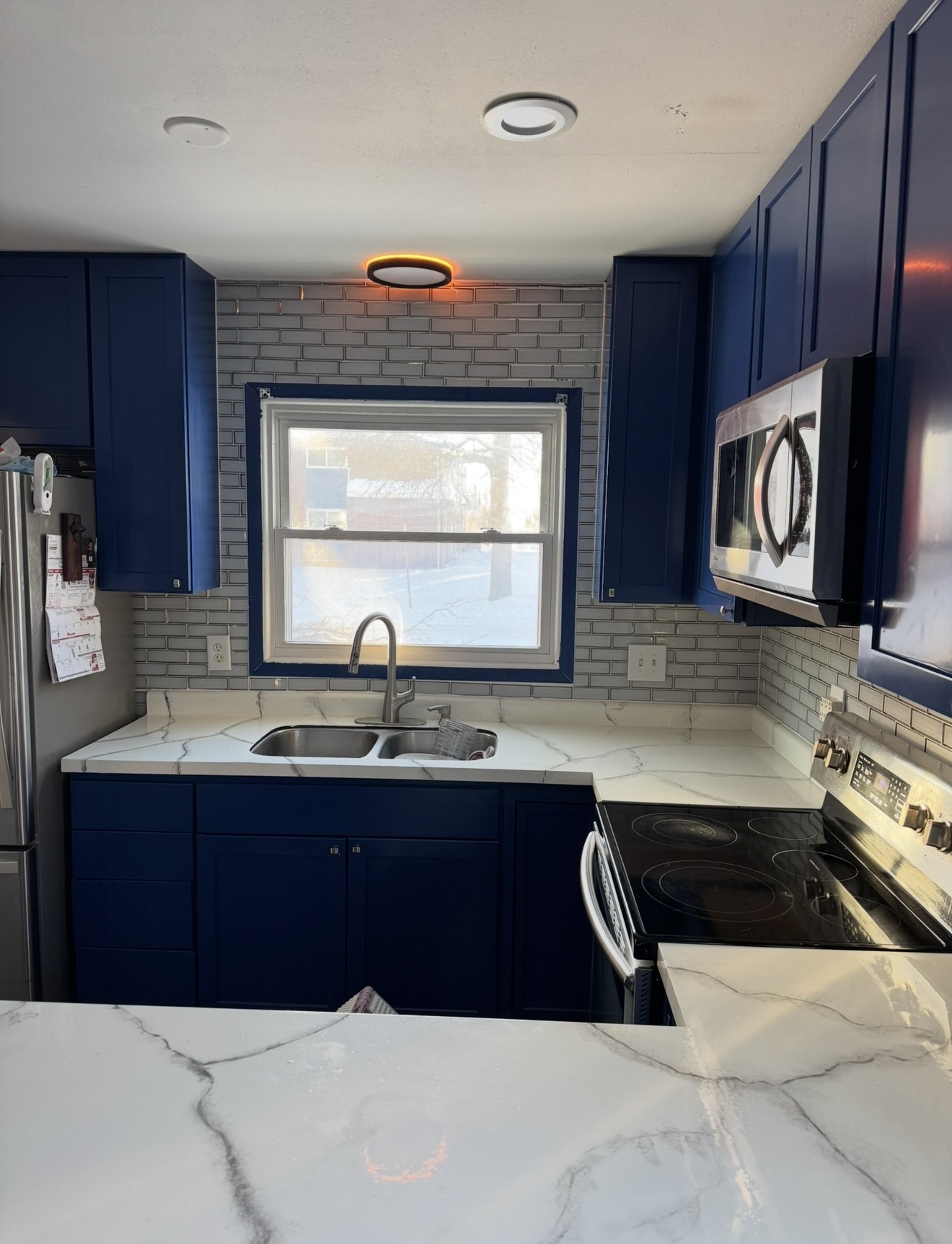 Finished blue kitchen cabinets and countertops